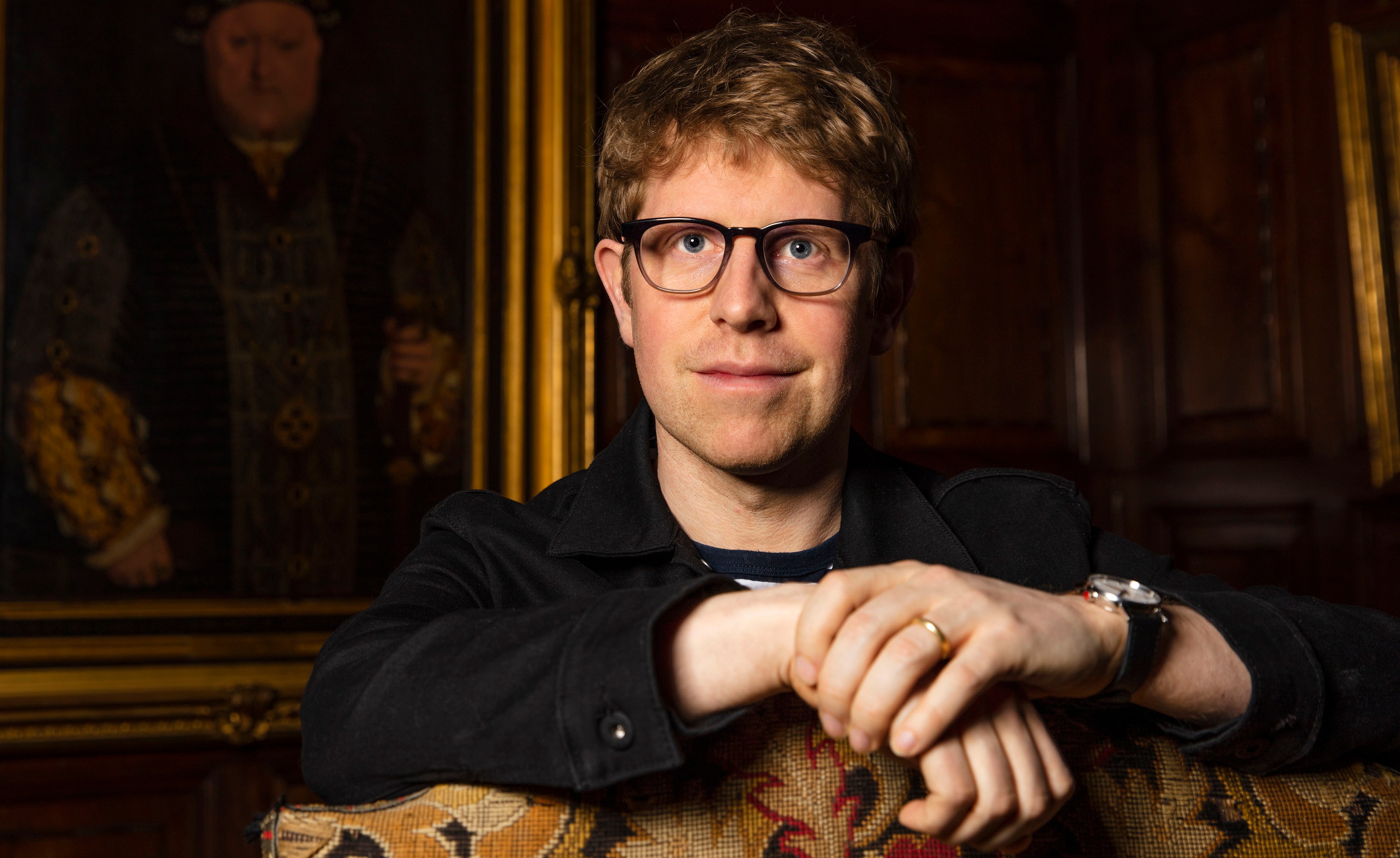 Josh Widdicombe in front of a portrait at Hever Castle & Gardens.