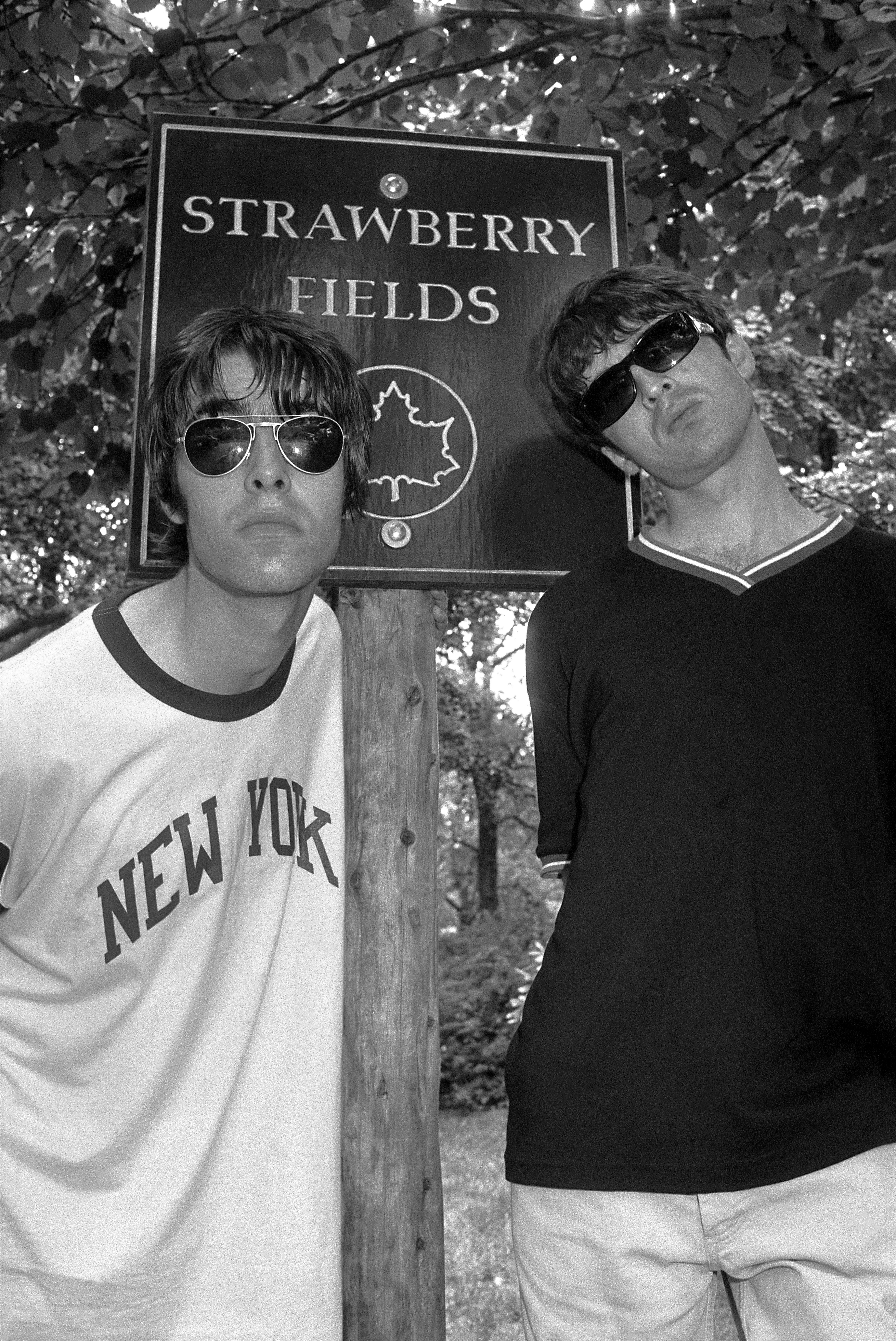 Black and white photo of Liam and Noel Gallagher at Strawberry Fields.