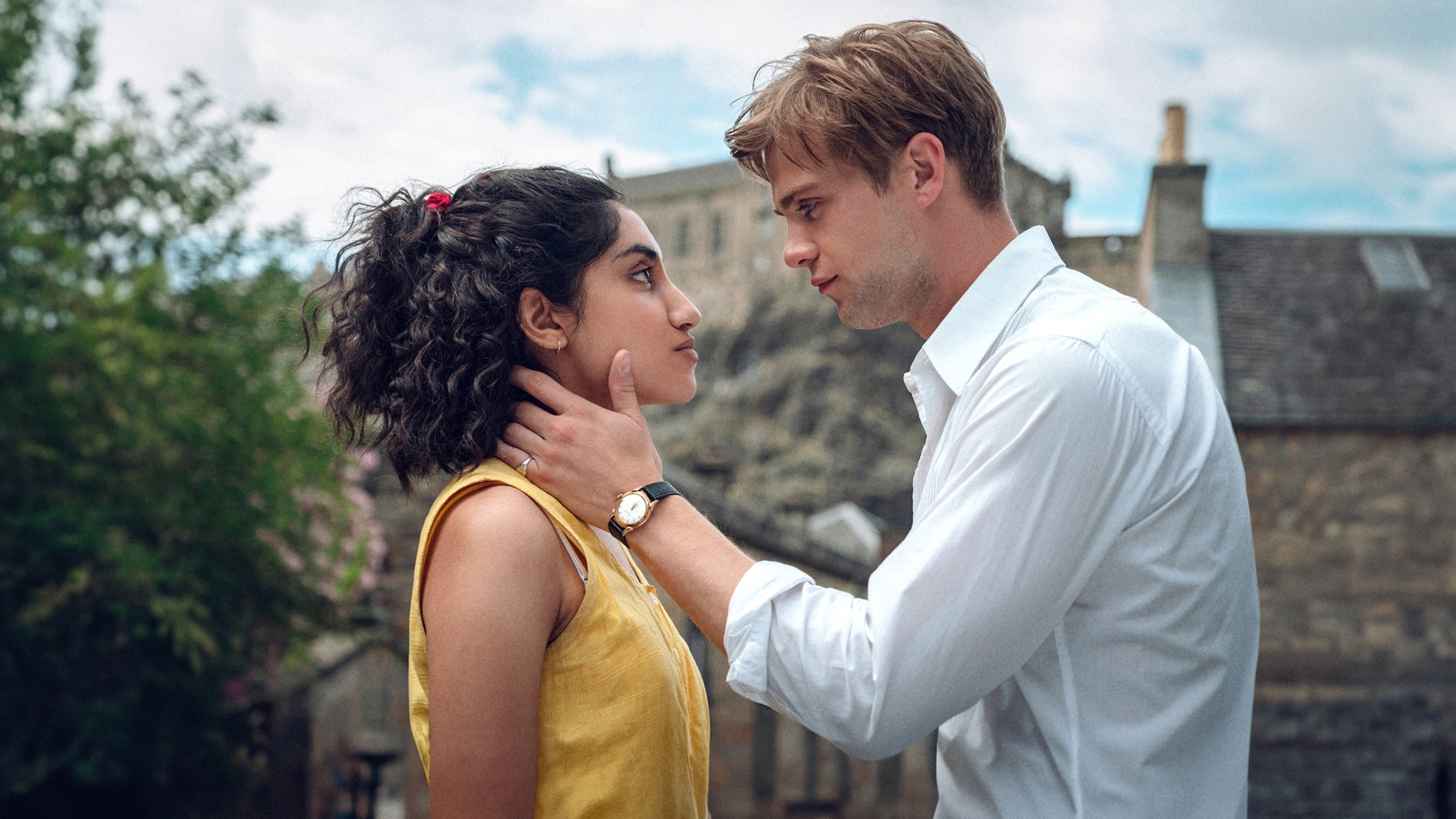 a man and a woman are looking at each other