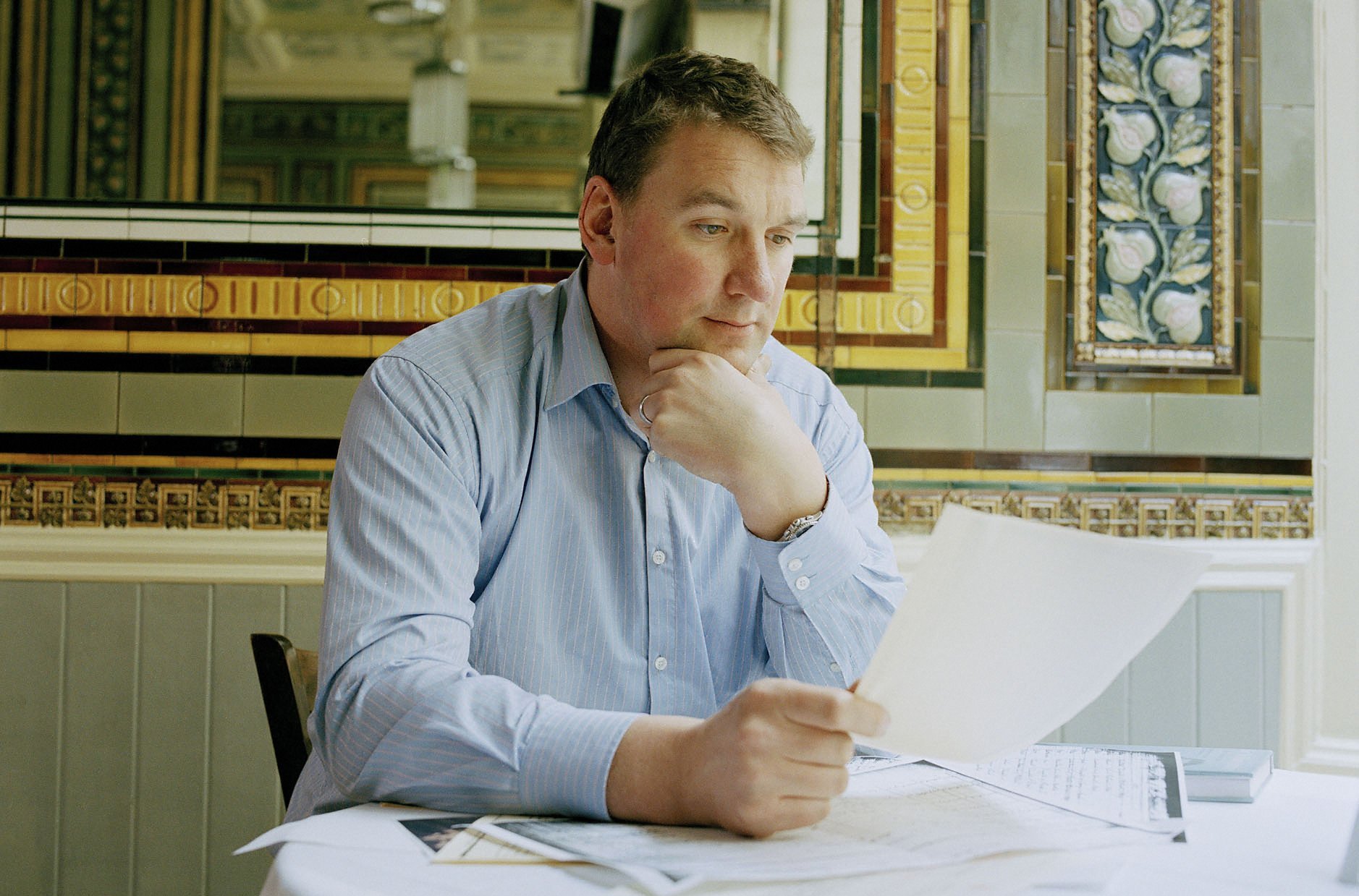 Matthew Pinsent reviewing documents for the BBC's 