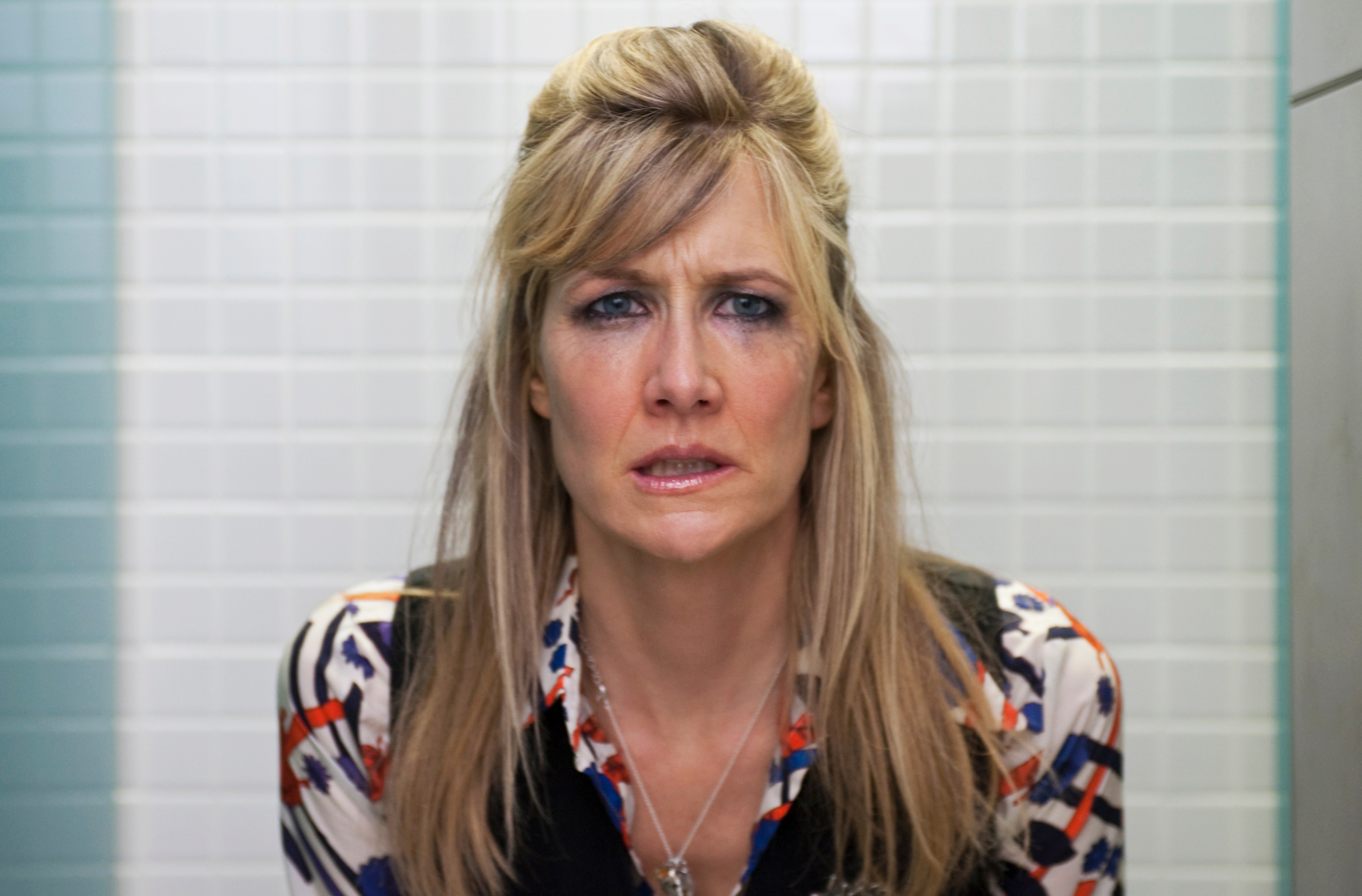 a woman making a funny face in a bathroom