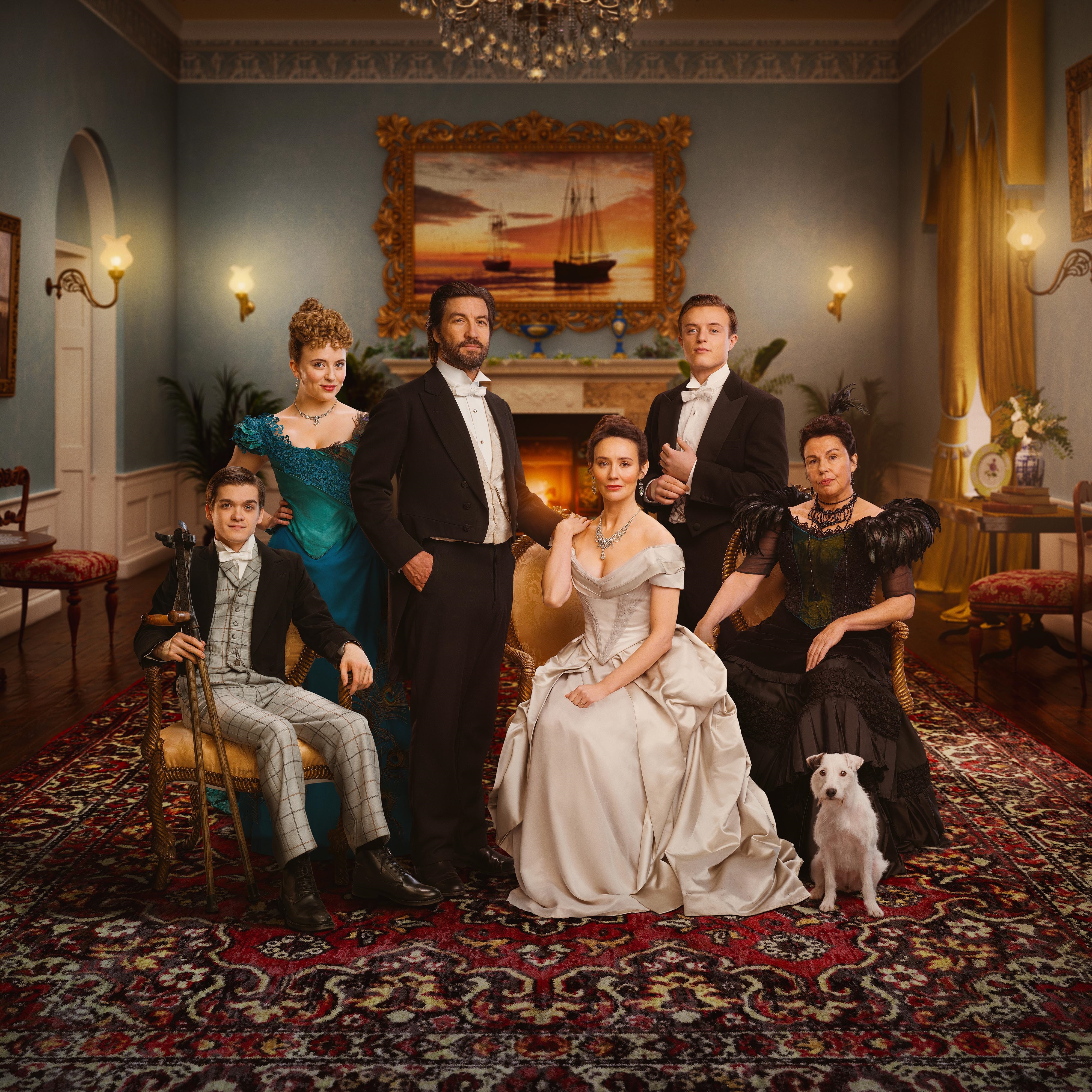 a group of people posing for a picture with a dog