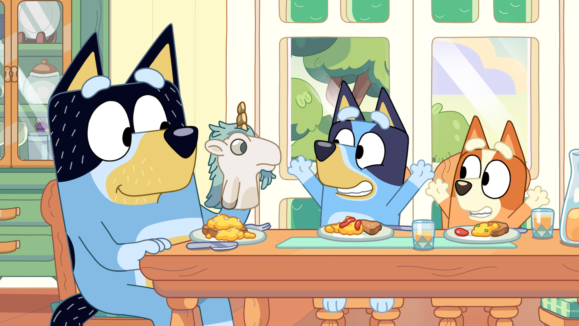 a group of cartoon dogs are sitting at a table eating food